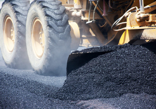 Asphalt being laid in a parking lot. Learn the asphalt paving dos and don'ts here!