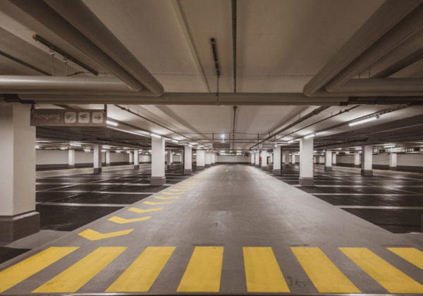 A parking garage that needs sealing. Learn about parking lot sealcoating here!