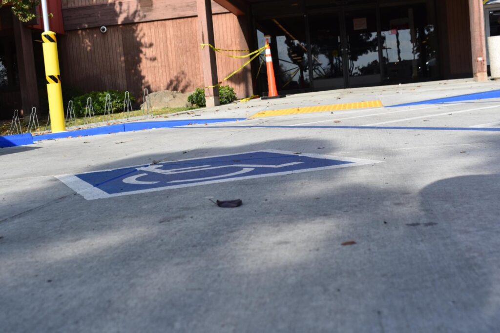 ADA Compliance Alt Text: A handicapped parking space, painted for ADA compliance, on a commercial property in California.