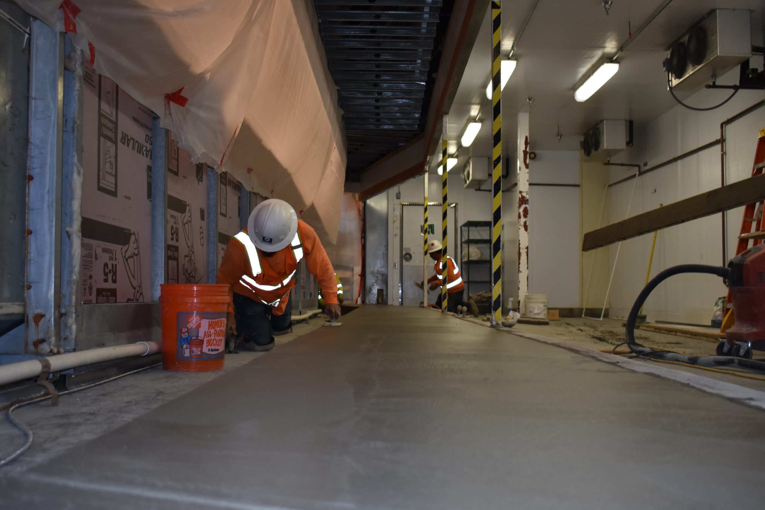 Industrial Concrete Services The DRYCO team completing concrete work in a warehouse. We offer industrial concrete services like this in the Bay Area and California Central Valley.
