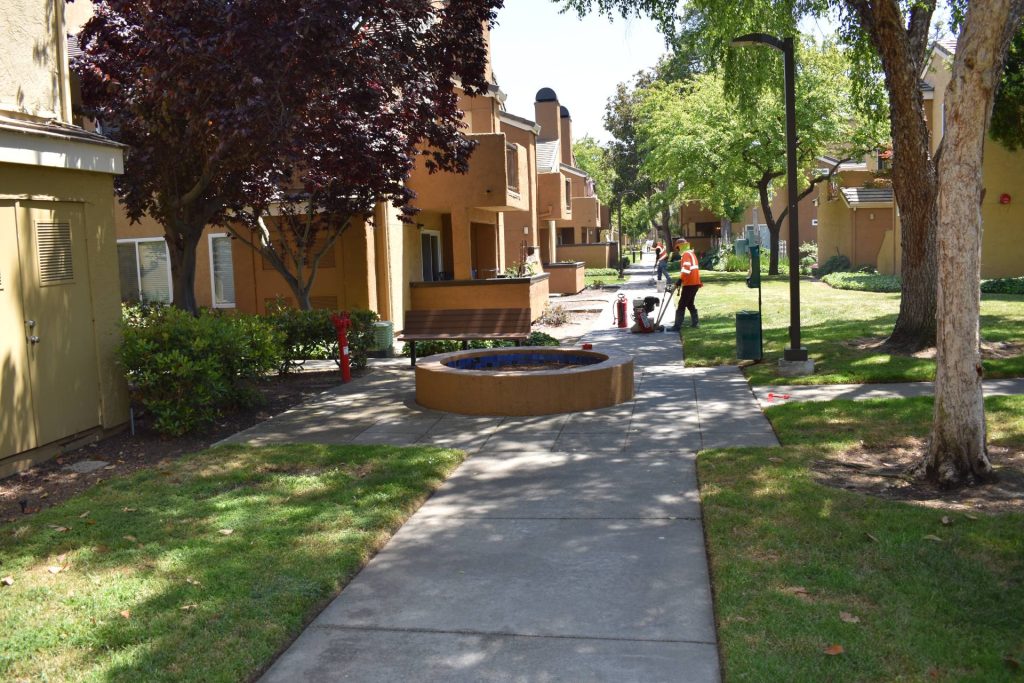 A Property Manager’s Guide to Asphalt & Concrete 1 The DRYCO team completing a concrete sidewalk project for an apartment complex in Foster's Landing.